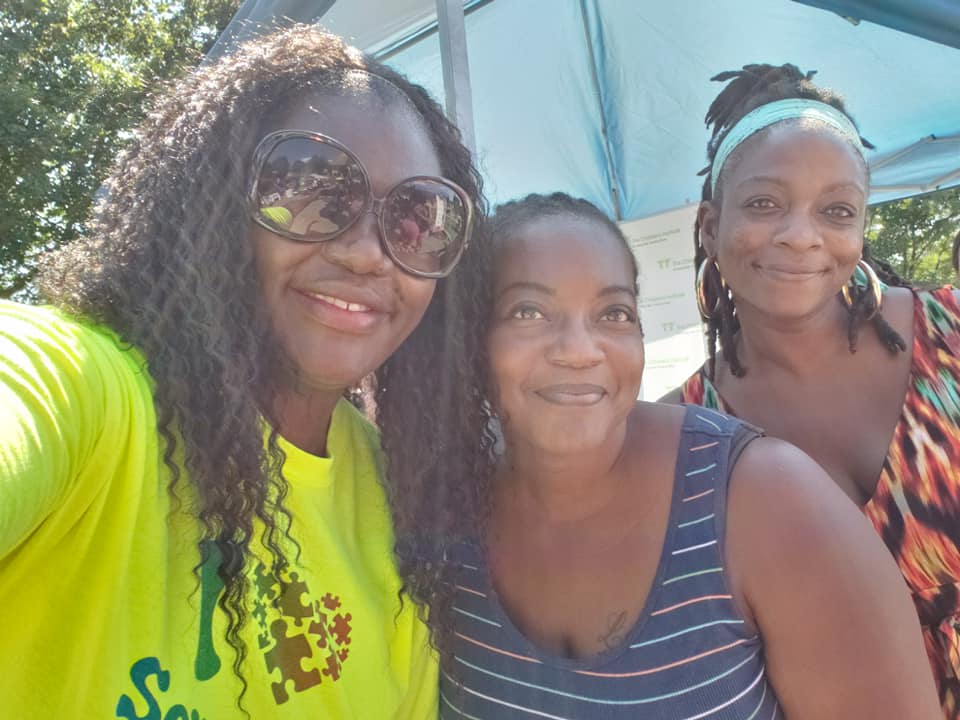 Group of 3 smiling black women who are parents with autism urban connection